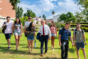Peter with two students. 