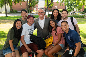 Peter with two students. 