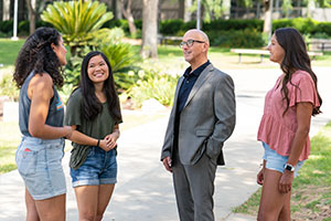 Peter with two students. 